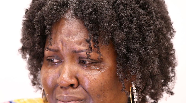 Suicide survivor Doris Adhuze, a mom whose 13-year-old son Jovany hanged himself last year, fights back tears during an interview discussing her loss on Thursday, Sept 13, 2018, in Decatur. Curtis Compton/ccompton@ajc.com