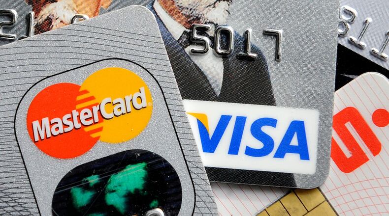 Credit card debt is at a nearly five-year high as consumers feel more comfortable relying on credit and are taking out new cards, according to data from credit reporting agencies.