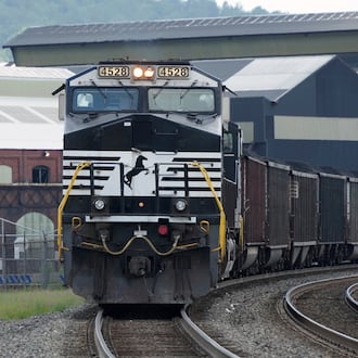 A Norfolk Southern freight train rolls past the U.S. Steel's Clairton Coke Works on Tuesday, Aug. 12, 2025, in Clairton, Pa. Union Pacific plans to acquire Atlanta’s Norfolk Southern for $85 billion. (Gene J. Puskar/AP)