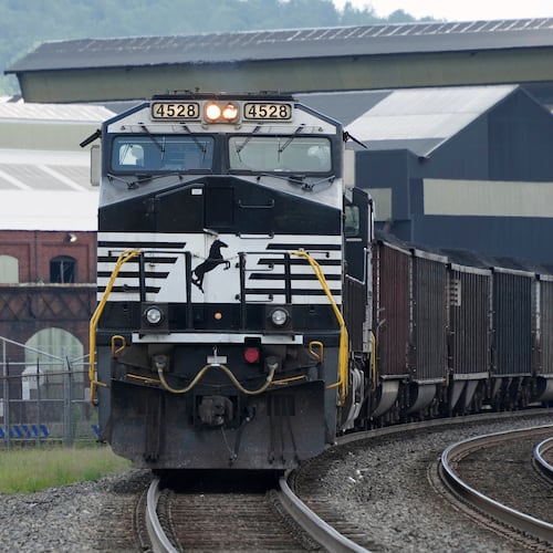 A Norfolk Southern freight train rolls past the U.S. Steel's Clairton Coke Works on Tuesday, Aug. 12, 2025, in Clairton, Pa. Union Pacific plans to acquire Atlanta’s Norfolk Southern for $85 billion. (Gene J. Puskar/AP)