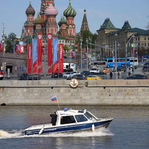 A police boat patrol the waters of the Moskva River near Red Square decorated for the celebrations of the 81st anniversary of the Soviet Union's victory over Nazi Germany at World War II during the Victory Day military parade rehearsal in Moscow, Russia, Thursday, May 7, 2026, backdropped by the St. Basil's Cathedral. (AP Photo/Alexander Zemlianichenko)