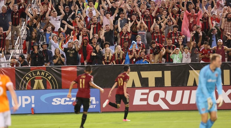 Miguel Almiron celebrates after scoring his first goal in Atlanta United’s win over Houston on Saturday at Georgia Tech’s Bobby Dodd Stadium. (Miguel Martinez / Mundo Hispanico)