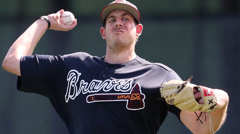 A slimmed down Braves pitcher Aaron Blair loosens up his arm during spring training on Thursday, Feb 15, 2018, at the ESPN Wide World of Sports Complex in Lake Buena Vista, Fla.  Curtis Compton/ccompton@ajc.com