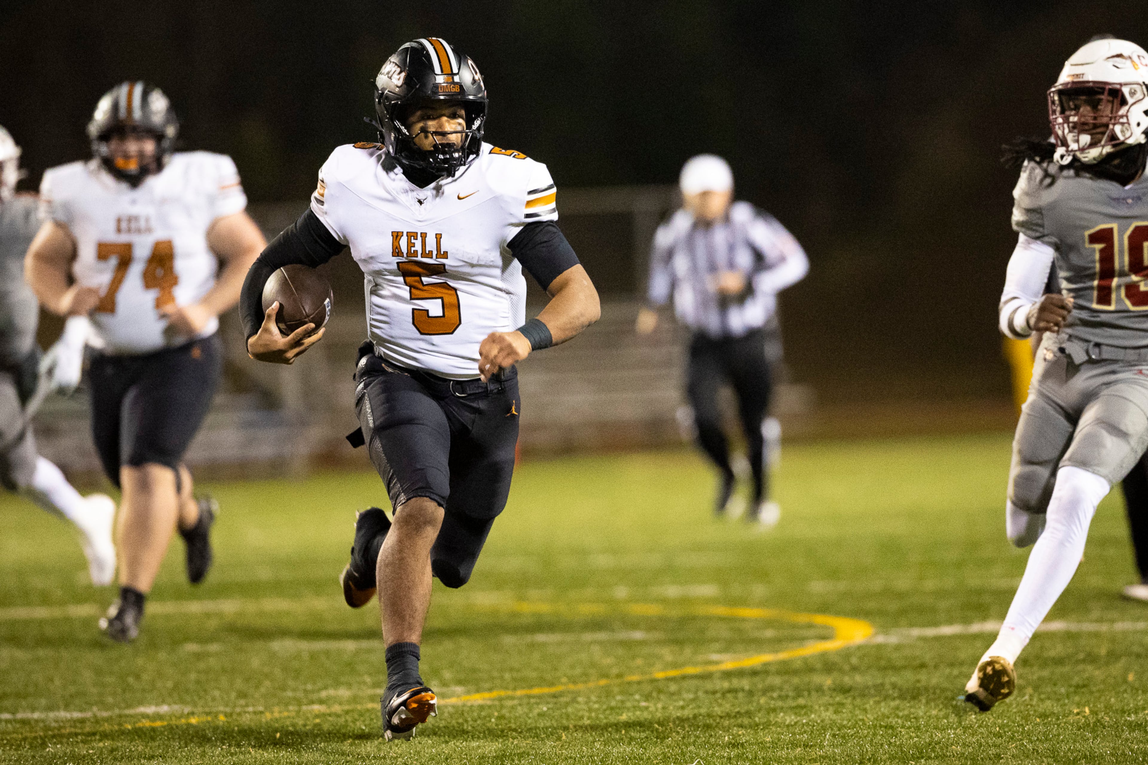 Kell quarterback Kaleb Narcisse (5) runs with the ball during the first half of the class 4A semifinal against Creekside at Creekside High School in Fairburn, GA on Friday, December 5, 2025. (Oscar Guevara Saenz for the AJC)