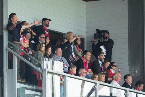 Wrexham co-owner Rob McElhenney, left, reacts during the English League One soccer match between Wrexham and Charlton Athletic at the Racecourse ground in Wrexham, Wales, Saturday, April 26, 2025. (AP Photo/Jon Super)