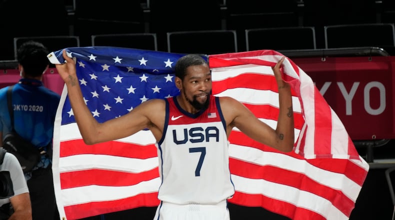 United States' Kevin Durant (7) celebrates after their win in the men's basketball gold medal game against France at the 2020 Summer Olympics, Saturday, Aug. 7, 2021, in Saitama, Japan. (AP Photo/Luca Bruno)