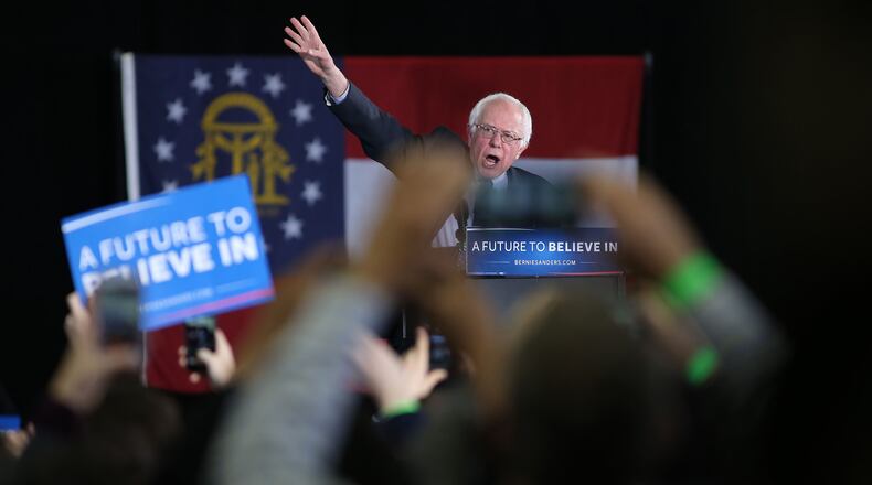 February 16, 2016 Atlanta: Bernie Sanders waves to the crowd as he takes the podium at his campaign rally Tuesday evening February 16, 2016 at Morehouse College. Ben Gray / bgray@ajc.com
