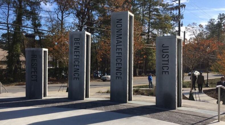 Mayor KasimReed, Councilmember C.T. Martin, Commissioner Amy Phuong and other city leaders on Nov. 22 cut the ribbon of Doctors Memorial Park which honors physicians from the former Southwest Hospital. CONTRIBUTED
