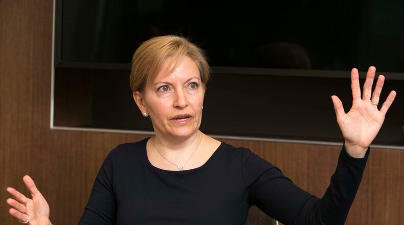 Julia Pastor talks about why she loves about working at Salesforce. The company was named top large workplace in the AJC's 2016 Top Workplaces report. (Phil Skinner, for the AJC)