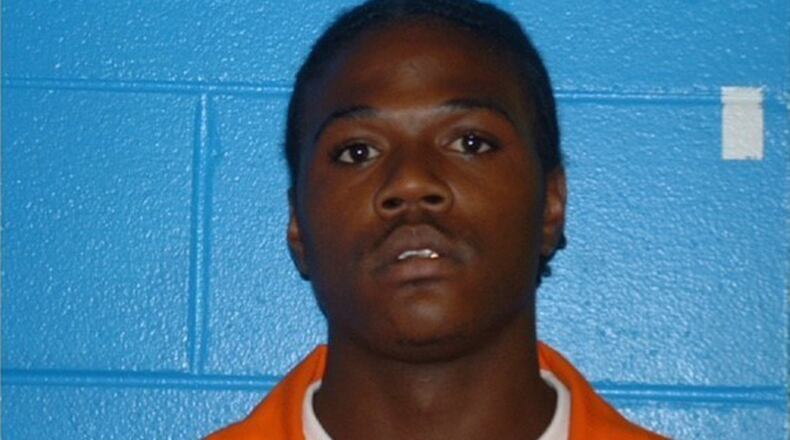 Minguell Kennedy Lembrick, 32, is suspected in the shooting of two Americus police officers, one of whom was killed. (Americus Police Department via AP)