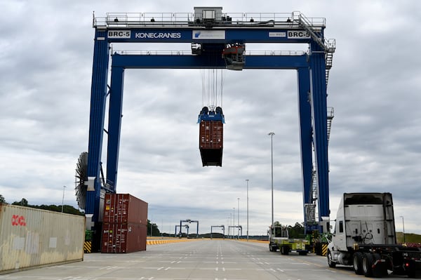 A crane moves a shipping container at a new $134 million inland port on Tuesday. (Hyosub Shin/AJC)