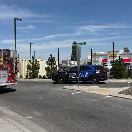 This image provided by KMVT shows the scene of a shooting that started at an In-N-Out Burger restaurant, Saturday, Aug. 1, 2026 in Twin Falls, Idaho. (KMVT via AP)