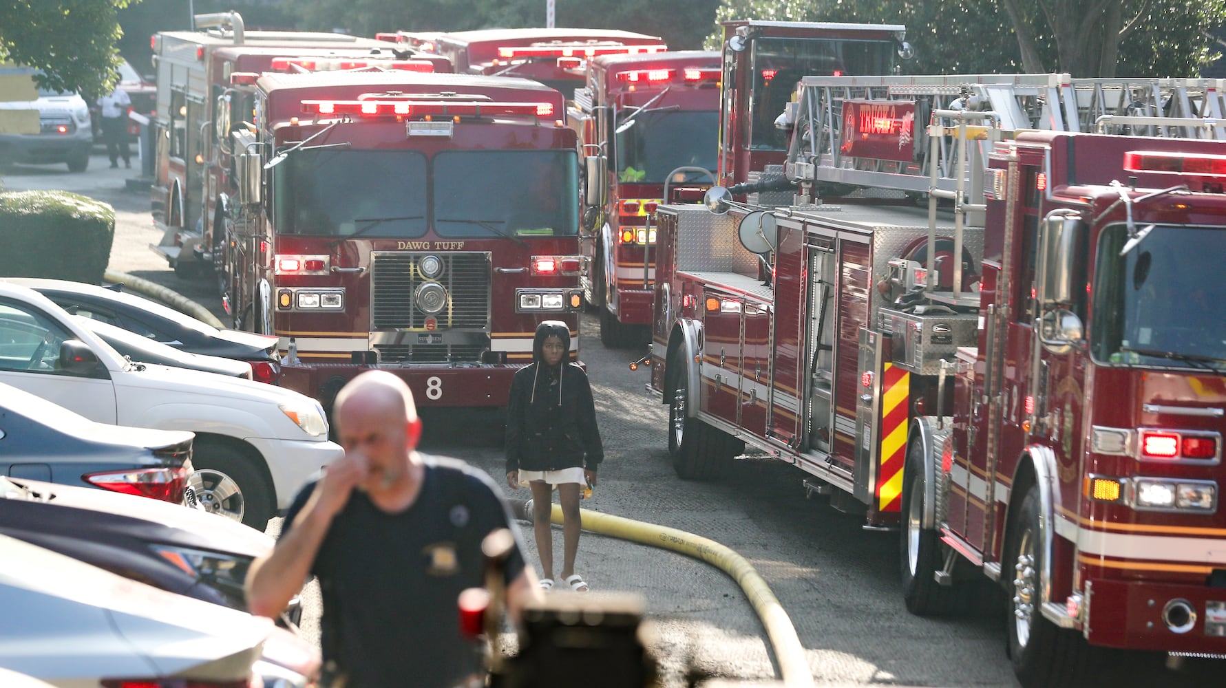 July 18, 2022 DeKalb County: All residents of a Brookhaven apartment building were able to escape their homes safely when a massive blaze broke out early Monday morning, July 18, 2022. No injuries were reported in the fire at the Evergreen Lenox Park apartments, which sent huge flames and smoke high into the air above nearby Roxboro and North Druid Hills roads at the start of the morning commute. Everyone inside the building evacuated before the first crews arrived about 6:30 a.m., thanks in large part to the effort of one man. Yusuf Thorne was on his way into work when he heard a subtle cracking sound and spotted the fire coming from an apartment on the third floor. Thorne said he called 911, connected with a dispatcher, and immediately hung up to begin knocking on his neighborsÕ doors. He escorted one woman to safety and went back again to try to wake another neighbor. ÒHe eventually came out,Ó Thorne said. ÒI was going to have to kick the door down if they didnÕt get out of there.Ó Thorne said he had to continue knocking on doors as the fire spread. According to fire Capt. Jaeson Daniels, the flames reached an attic space and eventually destroyed several third-floor units. ÒIt started on the third floor so the fire didnÕt have very far to travel to get to the attic, really saving the apartments on the bottom from fire damage,Ó Daniels said. ÒBut unfortunately, the top apartments had severe fire damage.Ó He estimates about 18 families will lose their homes and need the assistance of the American Red Cross for temporary lodging and other emergency needs. Fire crews dug through the debris Monday morning to learn the extent of the damage. Investigators have not determined the fireÕs cause or exact origin. (John Spink / John.Spink@ajc.com)

