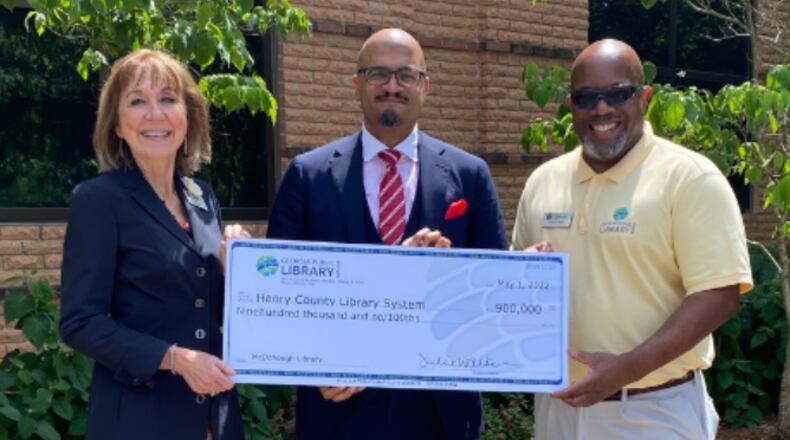 From left, state librarian Julie Walker, Henry County Library System assistant director Dr. Adam Townes, and Nathan Rall of the Georgia Public Library Service during the grant presentation earlier this year.