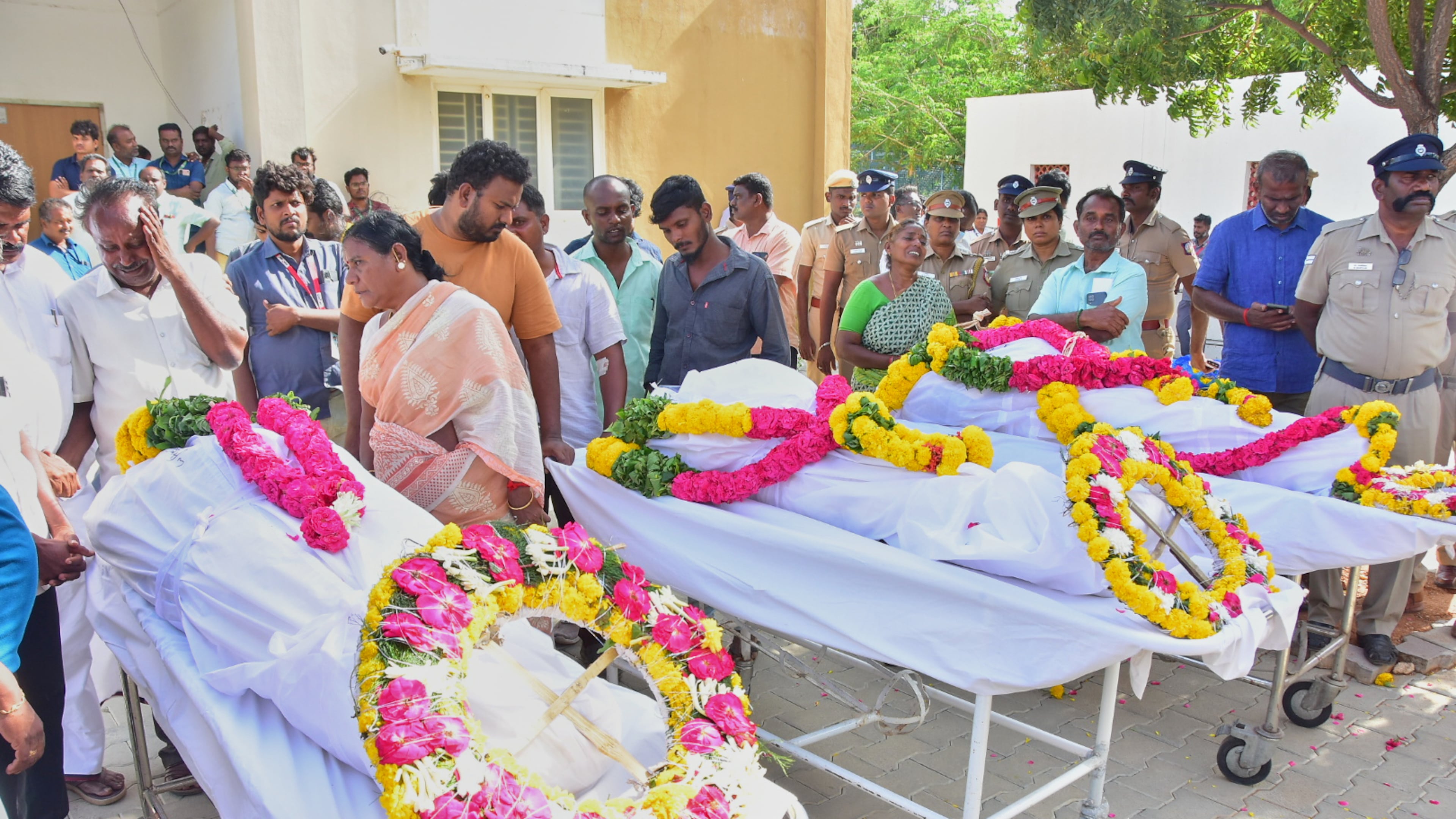 Relatives of people who were killed in a stampede during a rally for a popular Indian actor and politician, mourn as they take the bodies from a hospital, in Karur, in the southern state of Tamil Nadu, Sunday, Sept. 28, 2025. (AP Photo)