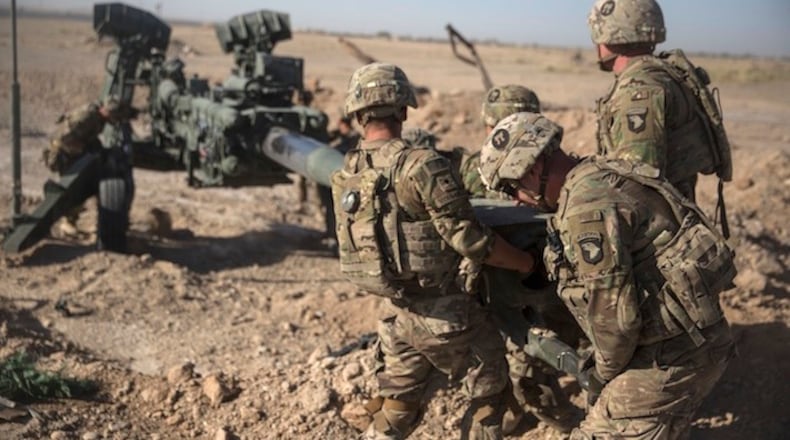 In this June 10, 2017 photo provided by Operation Resolute Support, U.S. Soldiers with Task Force Iron maneuver an M-777 howitzer, so it can be towed into position at Bost Airfield, Afghanistan.  Reversing his past calls for a speedy exit, U.S. President Donald Trump recommitted the United States to the 16-year-old war in Afghanistan Monday night, Aug. 21, 2017,  declaring U.S. troops must "fight to win." He pointedly declined to disclose how many more troops will be dispatched to wage America's longest war. (U.S. Marine Corps photo by Sgt. Justin T. Updegraff, Operation Resolute Support via AP,  File)