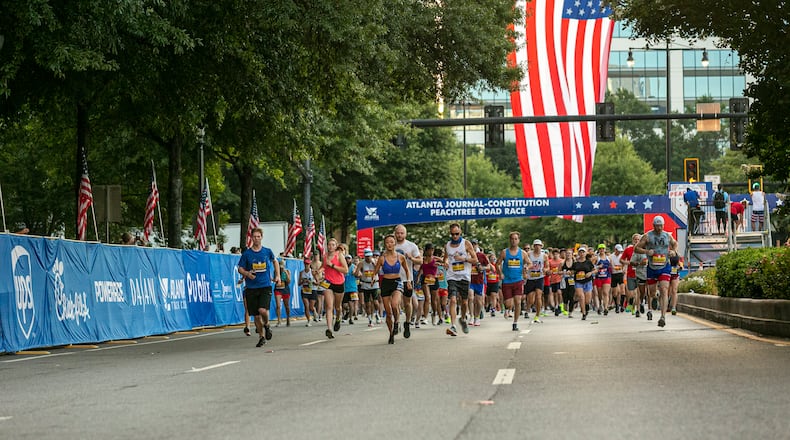 Runners take off at the start line of the 2024 AJC Peachtree Road Race. July 4, 2024.