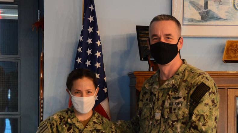 Atlanta native Lieutenant Erica A.
Leinmiller was presented with the Submarine Learning Center’s Officer Instructor of the Year Award by Captain Steven W. Antcliff, Commanding Officer, Naval Submarine School, aboard
Naval Submarine Base New London, Groton, CT. Leinmiller is a United States Naval Academy graduate who commissioned in 2013.