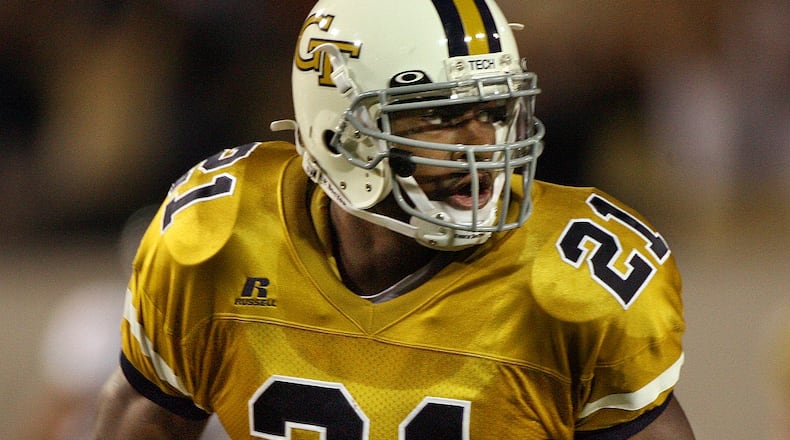 060921 ATLANTA, GA - Ga. Tech's Calvin Johnson (21) takes off downfield after a pass reception in the second quarter of the Georgia Tech vs Virginia football game Thursday night at Bobby Dodd Stadium 9/21/06. (Johnny Crawford / AJC Staff)