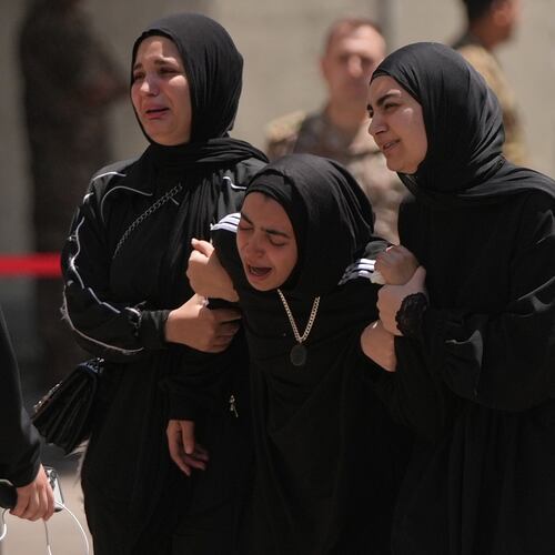 Relatives of the Lebanese soldier Hussein Nazzal, who was killed Saturday in south Lebanon along with a brigadier general and a captain in an Israeli airstrike, mourn during his funeral procession in Beirut, Sunday, June 7, 2026. (AP Photo/Hassan Ammar)