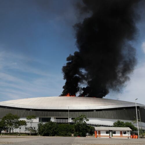 The roof of Rio de Janeiro's Olympic Park velodrome is on fire, Wednesday, April 8, 2026. (AP Photo/Bruna Prado)