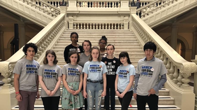 Students from Georgia high schools stand at the Georgia State Capitol after being denied access to public Senate and House galleries. ALAA ELASSAR / AJC