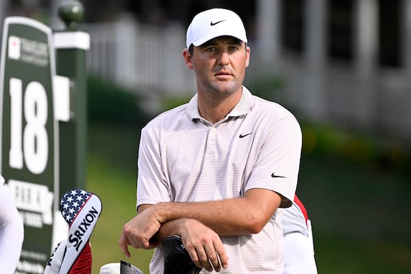 Scottie Scheffler waits at the 18th tee during the first round of the Travelers Championship golf tournament at TPC River Highlands, Thursday, June 19, 2025, in Cromwell, Conn. (AP Photo/Jessica Hill)