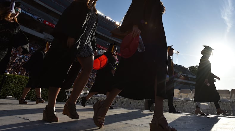 Students fill the University of Georgia’s Sanford Stadium for their 2016 graduation commencement. BRANT SANDERLIN/BSANDERLIN@AJC.COM