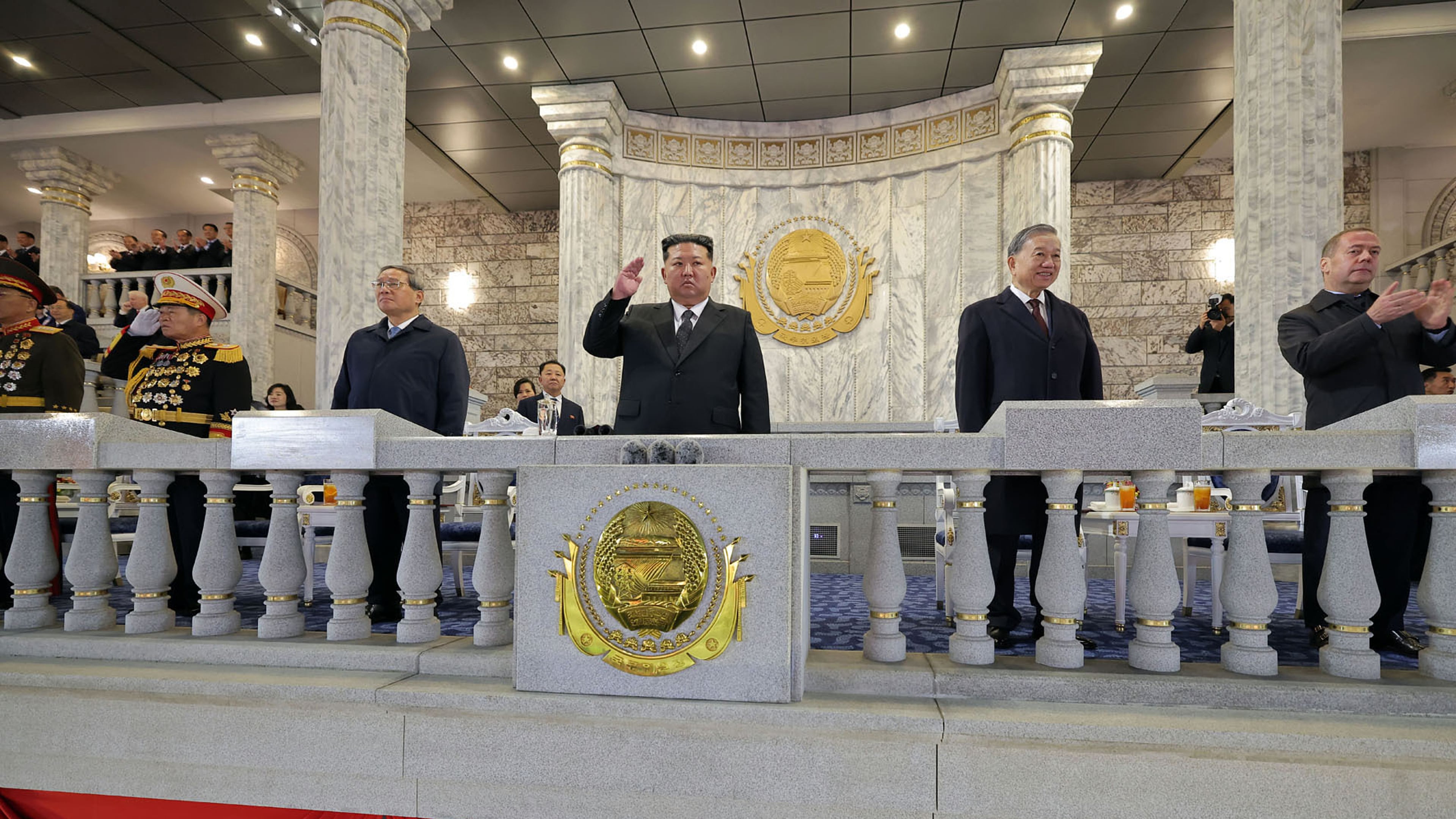 In this photo provided by North Korean government, North Korean leader Kim Jong Un, center, Chinese Premier Li Qiang, fourth right, Vietnamese Communist Party General Secretary To Lam, second right, Russian Security Council Deputy Chairman Dmitry Medvedev, right, attend the military parade marking the 80th anniversary of the founding of the ruling Worker's Party, in Pyongyang, North Korea, Friday, Oct. 10, 2025. Independent journalists were not given access to cover the event depicted in this image distributed by the North Korean government. The content of this image is as provided and cannot be independently verified. Korean language watermark on image as provided by source reads: "KCNA" which is the abbreviation for Korean Central News Agency. (Korean Central News Agency/Korea News Service via AP)
