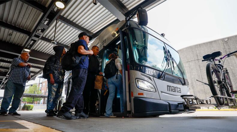 MARTA riders are seen getting on bus route 39 at the Lindbergh Center Station bus loop on Thursday, March 26, 2026. Every route in the system has been changed as part of a bus network redesign that's meant to bring more frequent and reliable service to more people. The new routes, which begin April 18, will cover less distance geographically but will run more frequently. (Miguel Martinez/AJC)