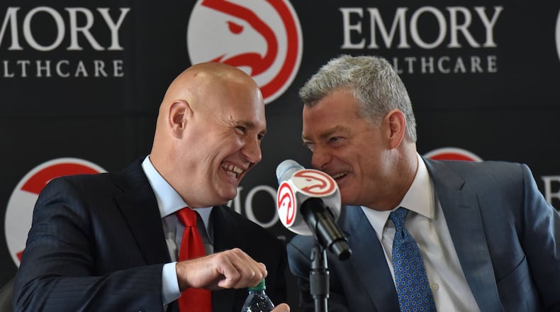 Hawks general manager Travis Schlenk (left) and Hawks principal owner Tony Ressler share a laugh before the news conference to officially introduce Schlenk at Philips Arena on Friday, June 2, 2017. HYOSUB SHIN / HSHIN@AJC.COM