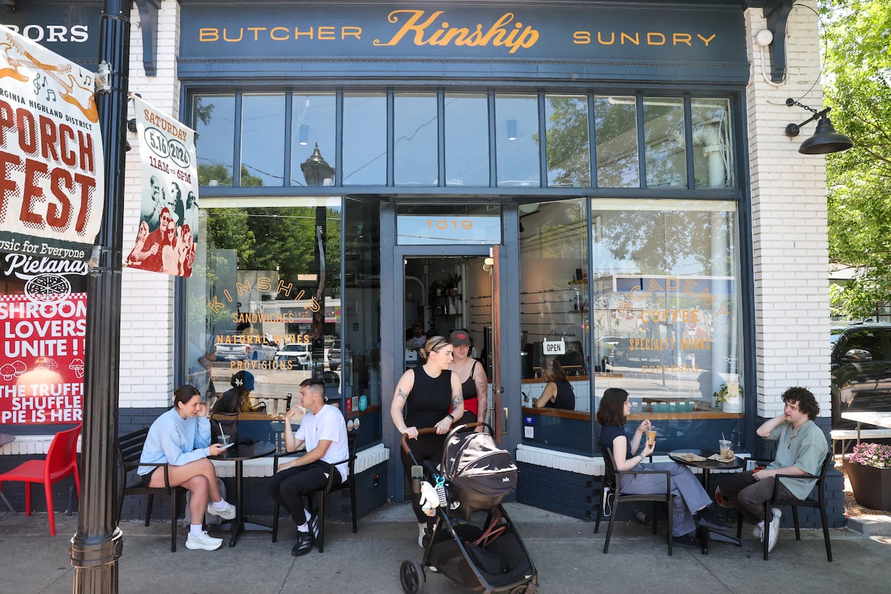 Patrons gather outside Kinship Butcher & Sundry in Virginia-Highland on May 15, 2026. Atlanta firm 26th Street Partners has acquired this retail strip and another in the intown neighborhood. (Arvin Temkar/AJC)