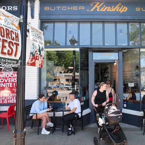 Patrons gather outside Kinship Butcher & Sundry in Virginia-Highland on May 15, 2026. Atlanta firm 26th Street Partners has acquired this retail strip and another in the intown neighborhood. (Arvin Temkar/AJC)