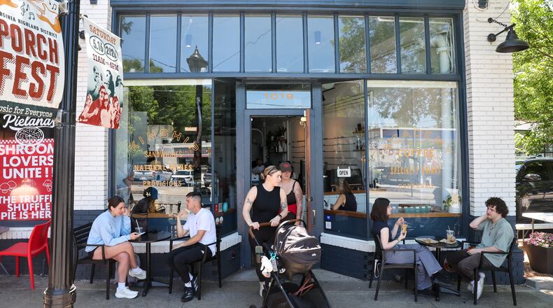 Patrons gather outside Kinship Butcher & Sundry in Virginia-Highland on May 15, 2026. Atlanta firm 26th Street Partners has acquired this retail strip and another in the intown neighborhood. (Arvin Temkar/AJC)