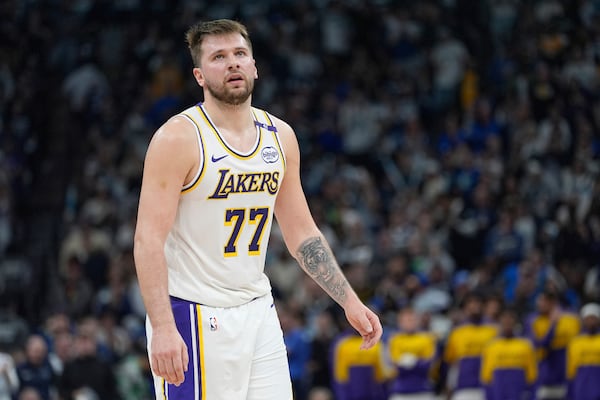 Los Angeles Lakers guard Luka Doncic (77) reacts after a foul called on the Lakers during the first half of Game 4 of an NBA basketball first-round playoff series against the Minnesota Timberwolves, Sunday, April 27, 2025, in Minneapolis. (AP Photo/Abbie Parr)