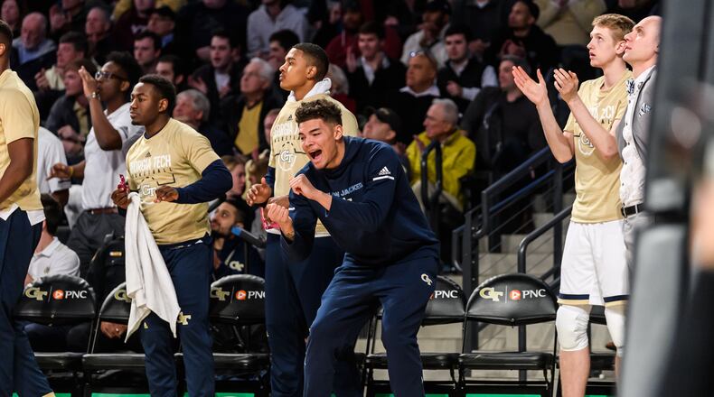 Georgia Tech forward Jordan Usher (center, in navy sweats) impressed strength and conditioning coach Dan Taylor with his eagerness to support his teammates in the first game after he transferred from USC, against Virginia Tech at McCamish Pavilion on January 9, 2019. (Danny Karnik/Georgia Tech Athletics)