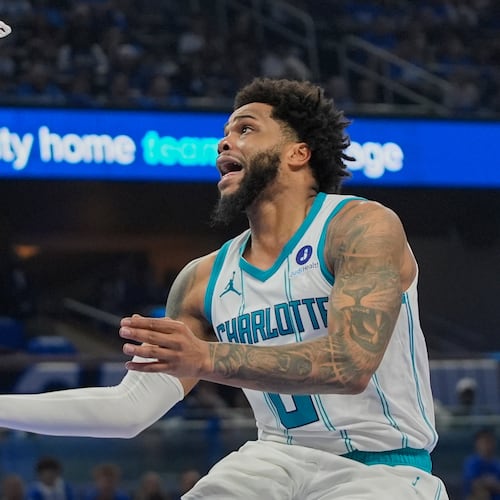 FILE - Charlotte Hornets forward Miles Bridges makes a shot against the Orlando Magic during the second half of an NBA play-in tournament basketball game, Friday, April 17, 2026, in Orlando, Fla. (AP Photo/John Raoux, file)