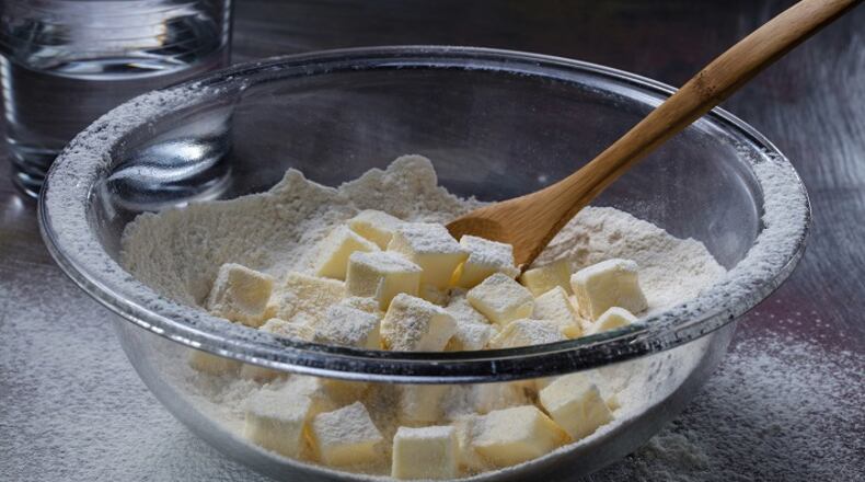 No need to cut the butter into the flour with this method. Instead roughly smash the butter cubes, then stir in water and knead briefly. (Zbigniew Bzdak/Chicago Tribune/TNS) Joan Moravek / food styling)