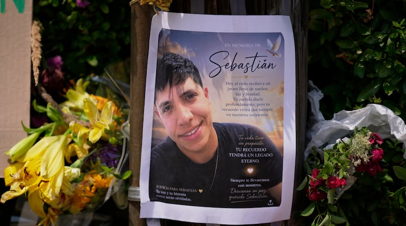 FILE - A poster of Johan Sebastián Durán Guerrero, a man killed by U.S. Immigration and Customs Enforcement, is displayed among flowers and tributes at a makeshift memorial in Biddeford, Maine, July 15, 2026. (AP Photo/Robert F. Bukaty, File)
