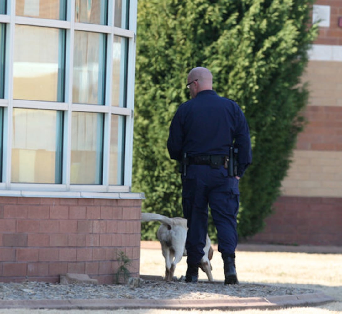 Police surround Woodstock High, remove gun
