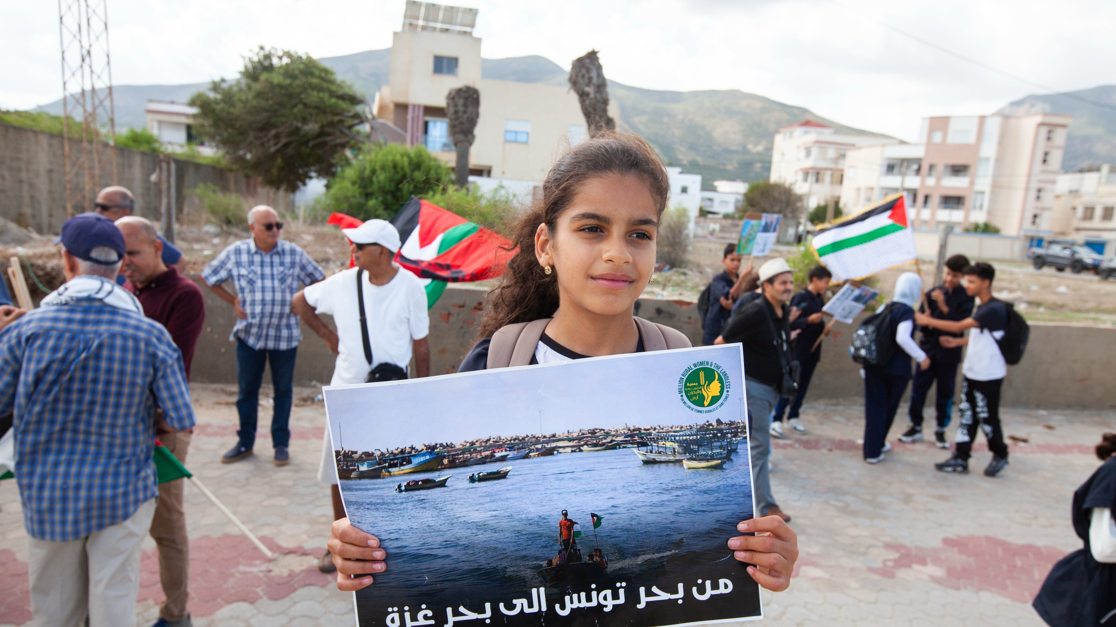 Demonstrators gather at a memorial site honoring the victims of the 1985 Israeli attack on Palestine Liberation Organization's headquarters, in Hammam Chott outside Tunisia's capital, Wednesday, Oct. 1, 2025. Banner in Arabic reads "From the sea of Tunisia to the sea of Gaza". (AP Photo/Ons Abid)