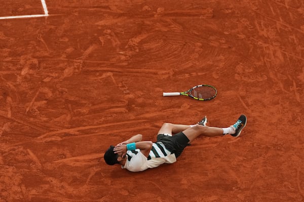 Spain's Carlos Alcaraz celebrates after winning the final match of the French Tennis Open against Italy's Jannik Sinner at the Roland-Garros stadium in Paris, Sunday, June 8, 2025. (AP Photo/Lindsey Wasson)