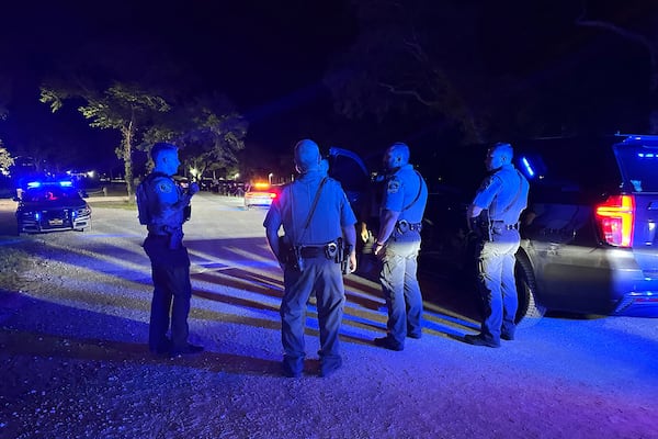 In this photo provided by the Horry County Police Department, police officers respond to the scene of a shooting on Sunday, May 25, 2025, in Little River, S.C. (Horry County Police Department via AP)