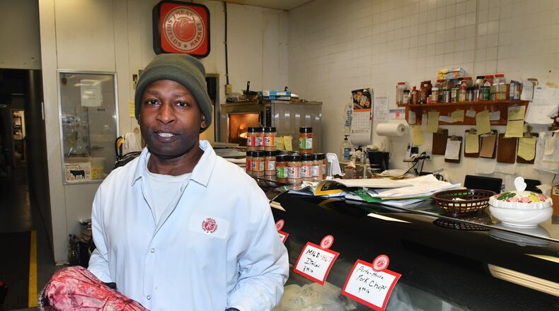 Diamond Mardell, owner of Shield's Meat Market in Emory Village, shows off a large cut of prime beef tenderloin in his shop. Shield's Meat Market has been serving as a butcher shop and grocery store for the Decatur area for more than 50 years. Chris Hunt for The Atlanta Journal-Constitution