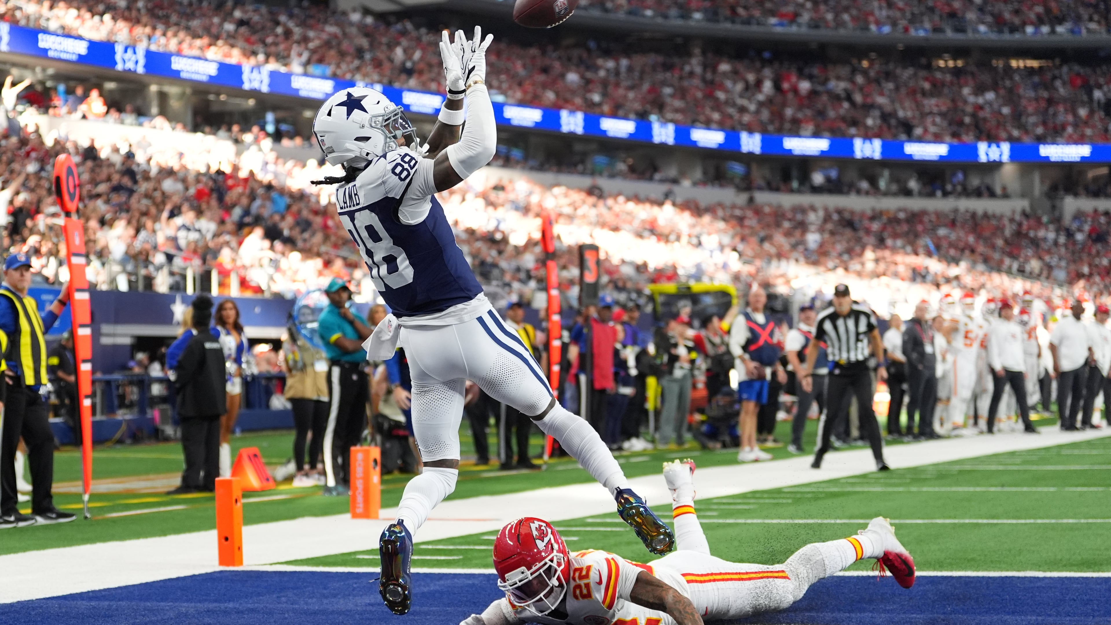 Dallas Cowboys wide receiver CeeDee Lamb (88) catches a touchdown pass as Kansas City Chiefs cornerback Trent McDuffie (22) defends during the first half of an NFL football game Thursday, Nov. 27, 2025, in Arlington, Texas. (AP Photo/Tony Gutierrez)
