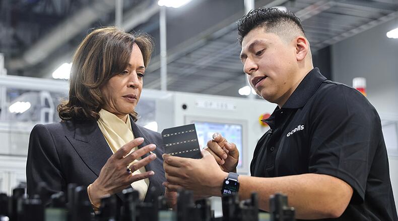 Vice President Kamala Harris tours the QCells Factory with an employee in Dalton, Ga. on Thursday, April 6, 2023. (Natrice Miller/natrice.miller@ajc.com)