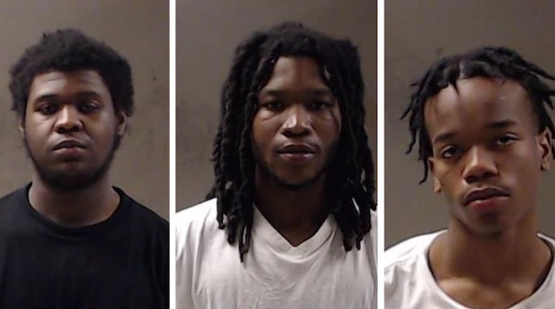Police arrested three men in connection with a 15-year-old boy's death at a DeKalb County apartment complex Tuesday. Cameron Jackson (from left), Monterie Junious and Chaz Lawson face felony murder and armed robbery charges.
