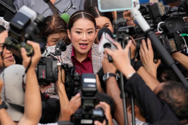 FILE - Paetongtarn Shinawatra, Pheu Thai party's top politician and youngest daughter of exiled former deposed Thai leader Thaksin Shinawatra, arrives for the registration of constituency candidates competing in upcoming general election, at the Thailand-Japan Youth Center stadium in Bangkok, Thailand, on April 3, 2023. (AP Photo/Sakchai Lalit, File)