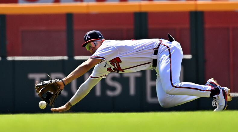 Braves second baseman Vaughn Grissom fields a grounder by Nationals catcher Tres Barrera in the third inning Wednesday at Truist Park. (Hyosub Shin / Hyosub.Shin@ajc.com)