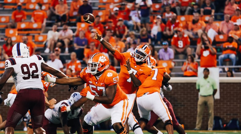 Former Clemson offensive tackle Paul Tchio (57) and quarterback Taisun Phommachanh (throwing) transferred to Georgia Tech and will face their former team in the Yellow Jackets' season opener Sept. 5. (Maddie Williams/Clemson Football)